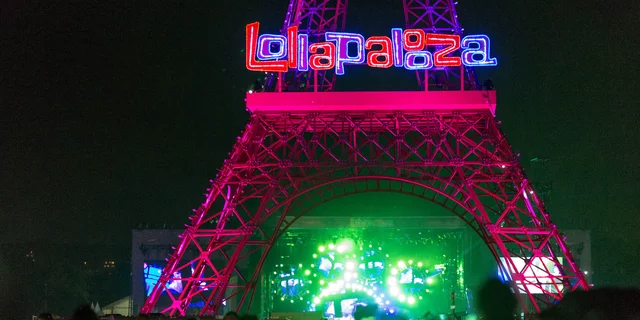 A replica of the Eiffel Tower with the festival logo stands on the grounds of the French edition of 