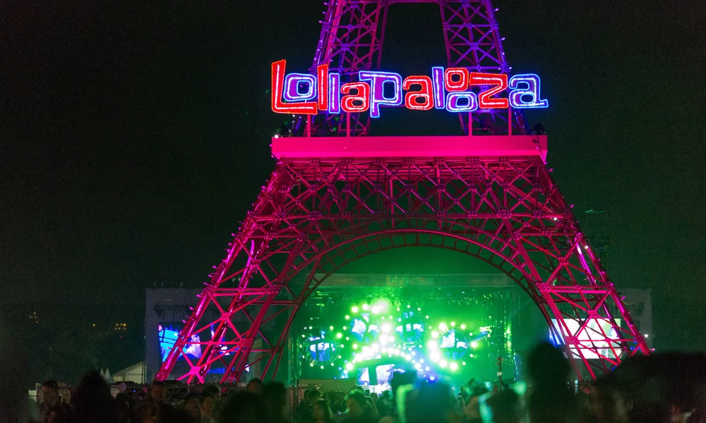 A replica of the Eiffel Tower with the festival logo stands on the grounds of the French edition of 