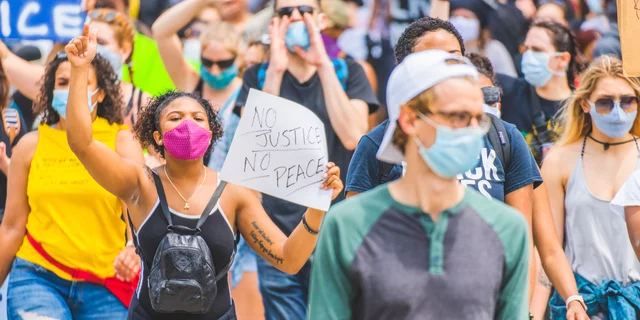 A young woman with a sign at the Cincinnati #BlackLivesMatter public demonstration protest.