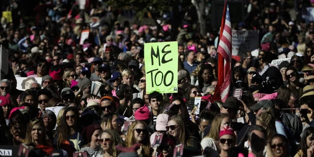 A Women's March protester holds up a MeToo sign
