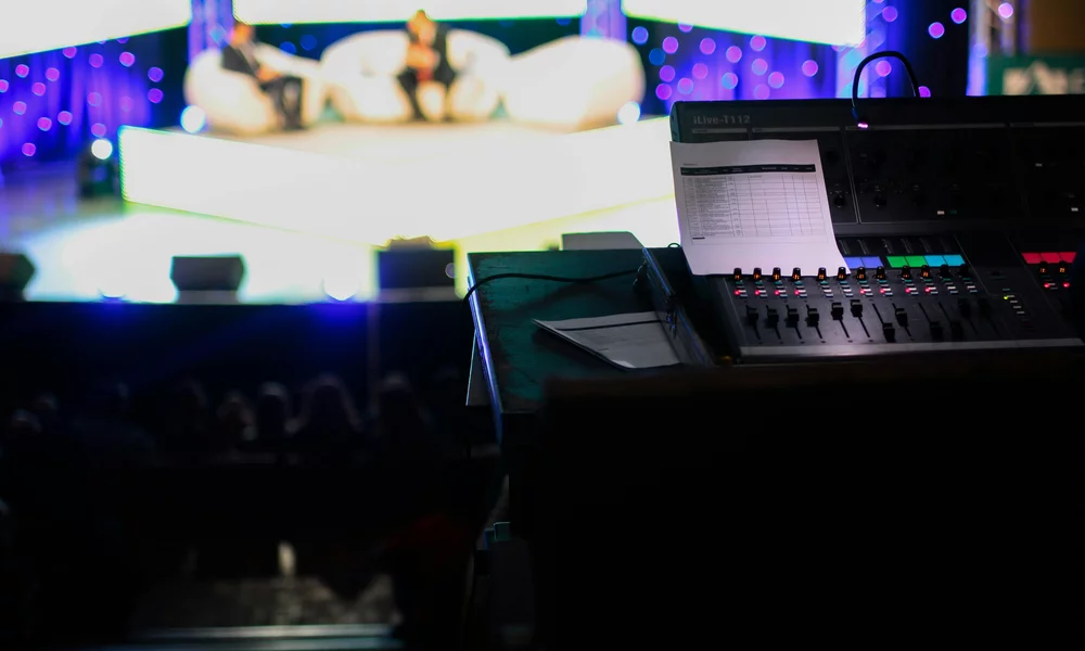 A blurry picture from the controlroom of a television show. 