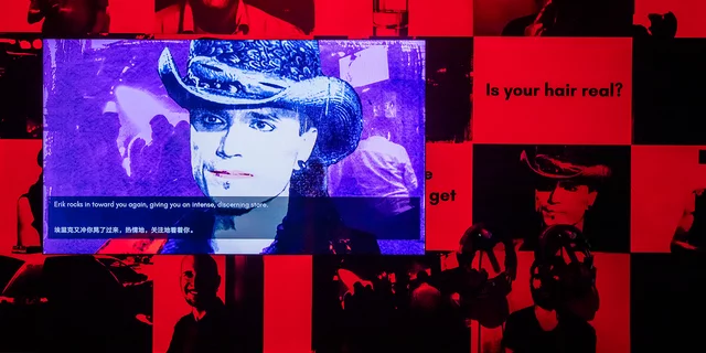 Museum exhibit of Angela Washko's The Game: The Game dating simulator